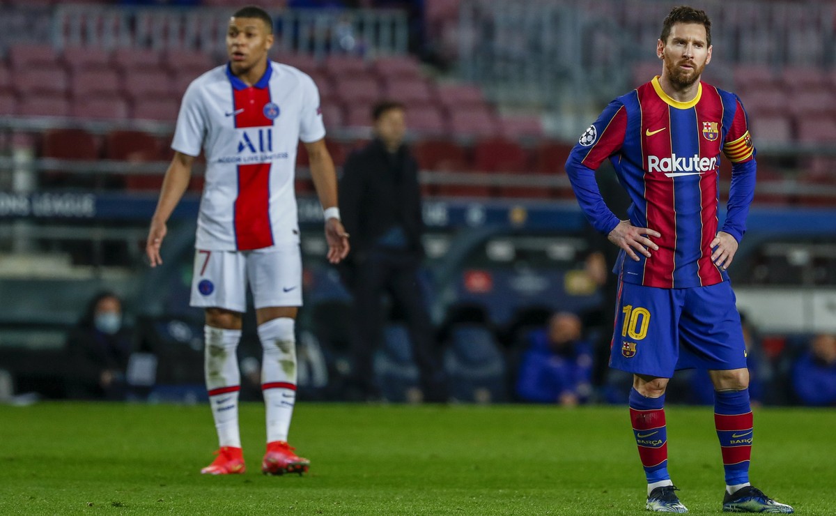Barcelona's Lionel Messi, right, and PSG's Kylian Mbappe during the Champions League round of 16, first leg soccer match between FC Barcelona and Paris Saint-Germain at the Camp Nou stadium  ...