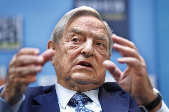 FILE - In this Sept. 24, 2011, file photo, George Soros speaks during a forum at the IMF/World Bank annual meetings in Washington. The AP reported on May 26, 2017, that a story shared online that clai ...