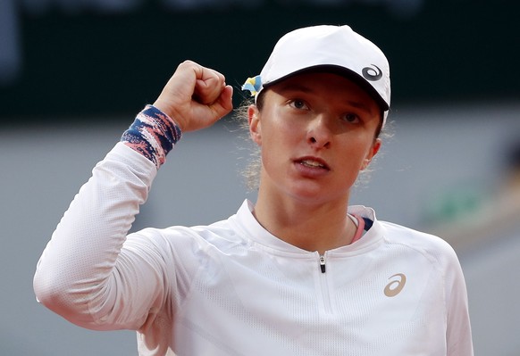 epa09986859 Iga Swiatek of Poland reacts after winning against Qinwen Zheng of China in their women?s fourth round match during the French Open tennis tournament at Roland ?Garros in Paris, France, 30 ...