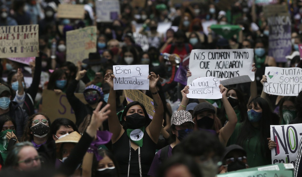 Women march ahead of International Women's Day in Quito, Ecuador, Sunday, March 7, 2021. (AP Photo/Dolores Ochoa)