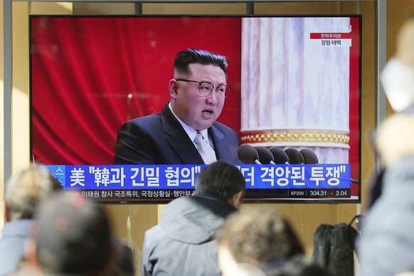 FILE - A TV screen shows a news program reporting with footage of North Korean leader Kim Jong Un in Pyongyang, at the Seoul Railway Station in Seoul, South Korea, on Dec. 27, 2022. South Korea?s mili ...