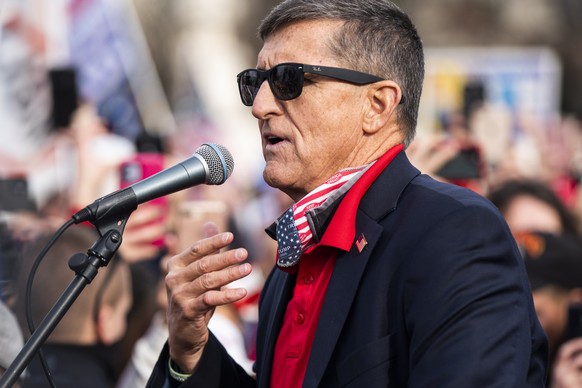epa08879705 Former National Security Advisor and convicted felon Michael Flynn speaks to supporters of US President Donald J. Trump who gathered outside the Supreme Court to echo Trump&#039;s baseless ...