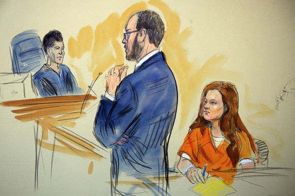 This courtroom sketch depicts Maria Butina, a 29-year-old gun-rights activist suspected of being a covert Russian agent, listening to Assistant U.S. Attorney Erik Kenerson as he speaks to Judge Debora ...