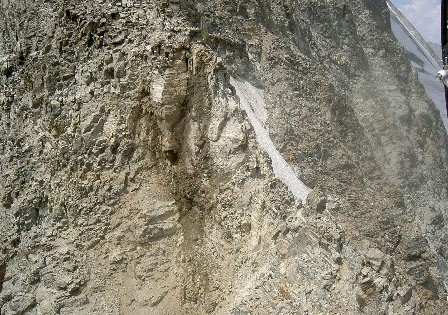 Aerial view from a helicopter to the rock slide on the Matterhorn in Zermatt, Switzerland, Tuesday, July 15, 2003. The rock slide on the Matterhorn had cut off the way back of 70 mountaineers on Tuesd ...