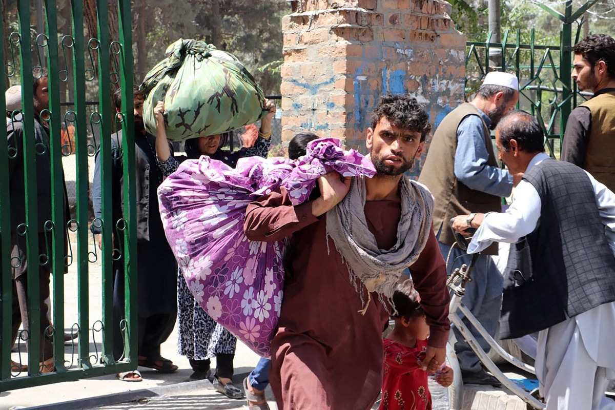 People depart to their homes after Taliban entered Kabul, Afghanistan, on Sunday on August 15, 2021. Afghan President Ashraf Ghani reportedly left the country after Taliban entered the Afghanistan cap ...