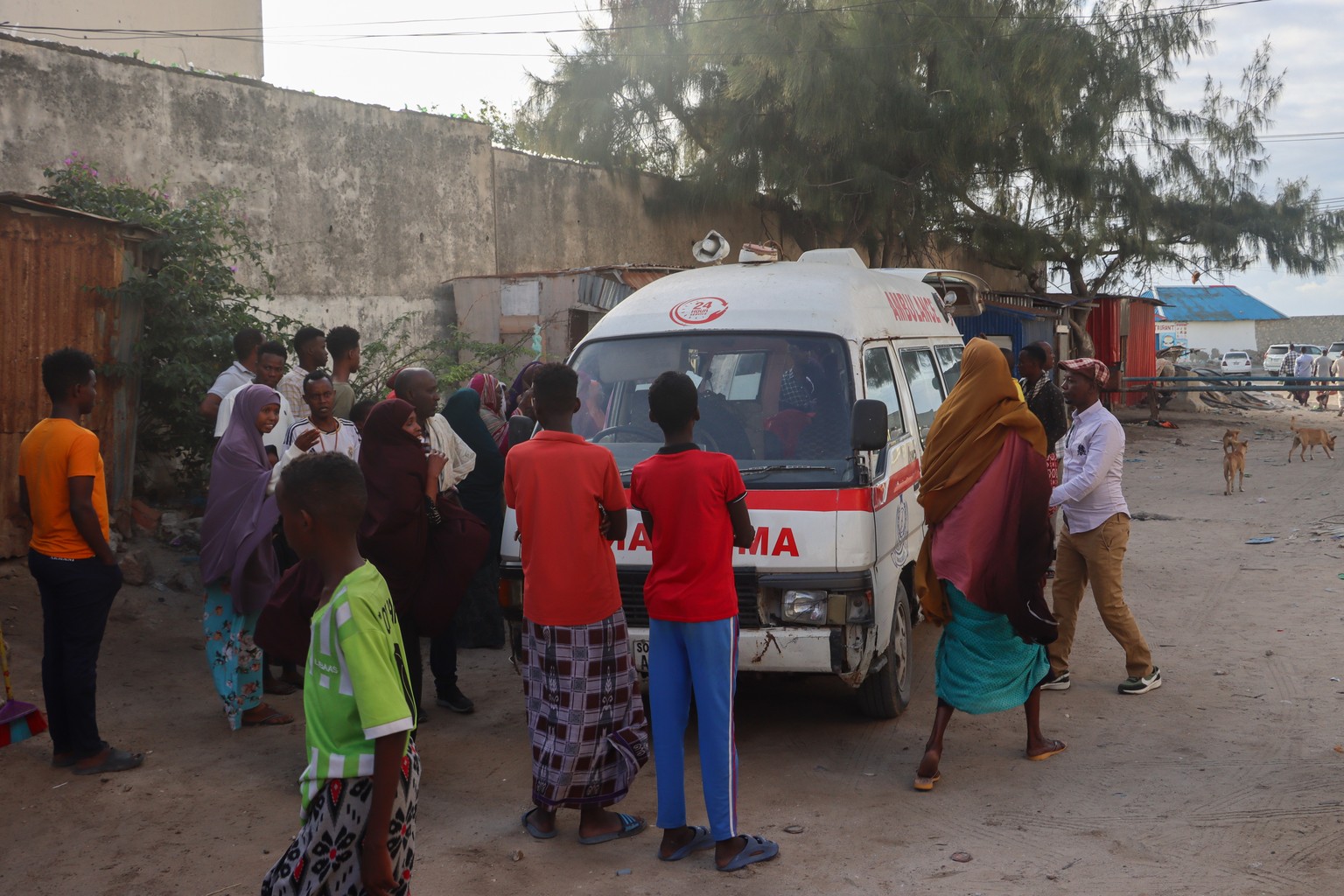 epa11521340 An ambulance car operates at the site of a suicide bombing in Mogadishu, Somalia, 03 August 2024. At least 32 people were killed and more than 60 were wounded in a suicide bombing and gun  ...