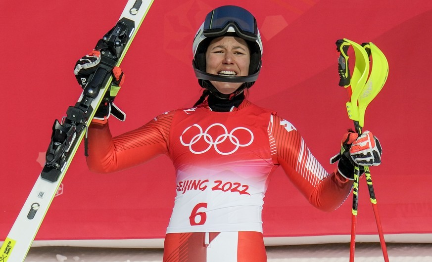 Wendy Holdener, of Switzerland, celebrates winning the bronze medal in the women&#039;s slalom at the 2022 Winter Olympics, Wednesday, Feb. 9, 2022, in the Yanqing district of Beijing.(AP Photo/Luca B ...