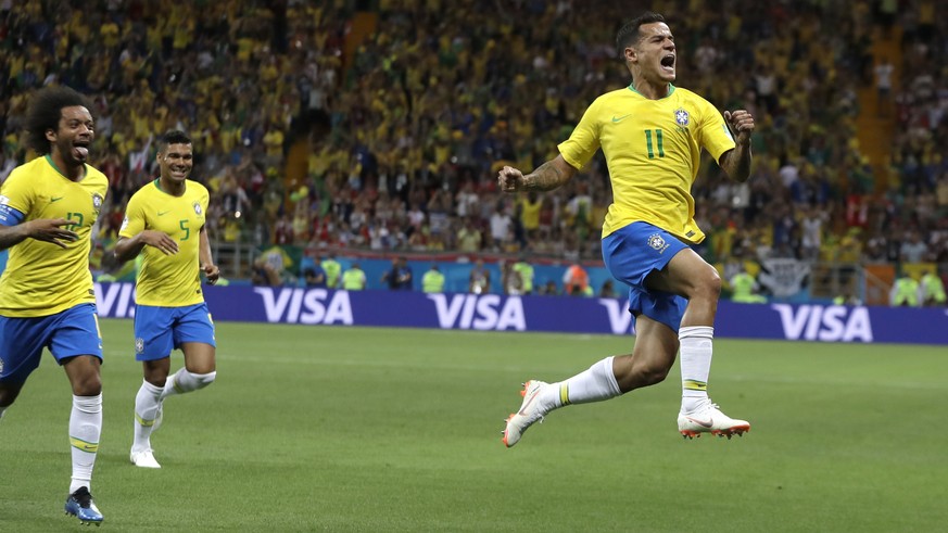 Brazil&#039;s Philippe Coutinho celebrates with teammates after scoring his side&#039;s opening goal during the group E match between Brazil and Switzerland at the 2018 soccer World Cup in the Rostov  ...