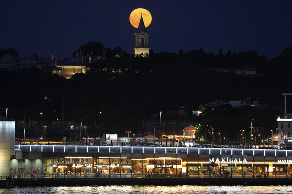A full moon rises behind Topkapi Palace in Istanbul, Turkey, Thursday, July 10, 2025. (AP Photo/Khalil Hamra)
Turkey Full Moon