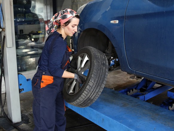 epa10026857 Kiana Yarahmadi, a 31 year old holder of BA degree in Law, works as a mechanic in Rad Auto Technic centre in Tehran, Iran, 21 June 2022. in Rad Auto Technic centre in Tehran, Iran, 21 June ...