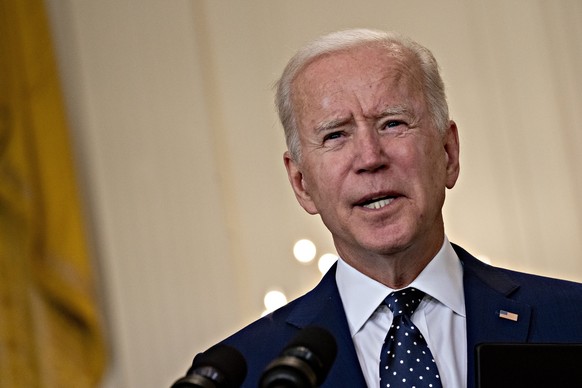 epa09138216 US President Joe Biden speaks in the East Room of the White House in Washington, DC, USA, on 15 April 2021. The Biden administration imposed a raft of new sanctions on Russia, including lo ...