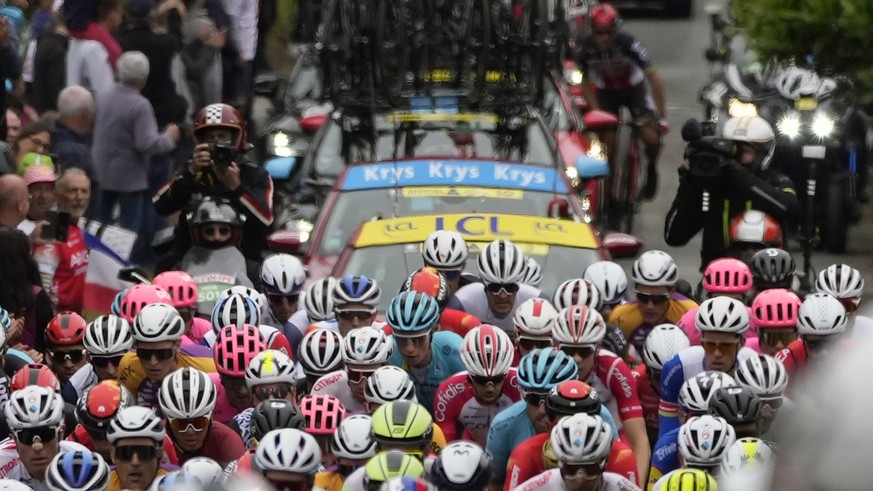 The pack rides during the first stage of the Tour de France cycling race over 197.8 kilometers (122.9 miles) with start in Brest and finish in Landerneau, France, Saturday, June 26, 2021. (AP Photo/Da ...