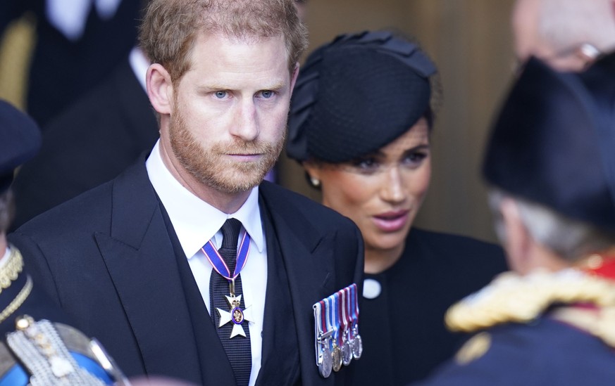 Prince Harry and Meghan, Duchess of Sussex leave Westminster Hall, London, Wednesday, Sept. 14, 2022 after the coffin of Queen Elizabeth II was brought to the hall to lie in state ahead of her funeral ...