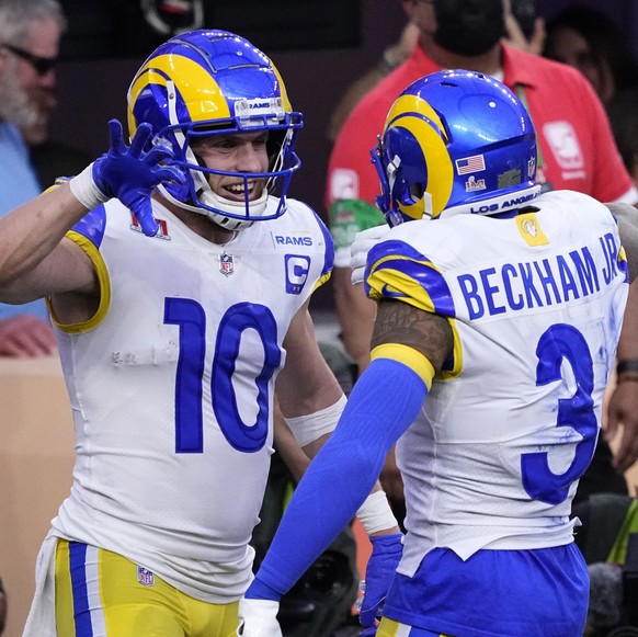 Los Angeles Rams wide receiver Cooper Kupp (10) celebrates his touchdown catch with wide receiver Odell Beckham Jr. (3) during the first half of the NFL Super Bowl 56 football game against the Cincinn ...