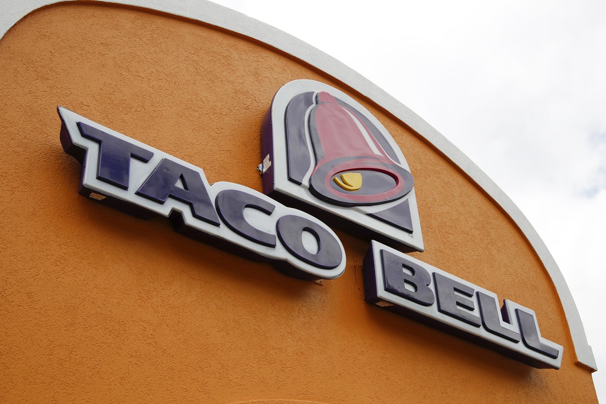 FILE - A sign hangs at a Taco Bell on May 23, 2014, in Mount Lebanon, Pa. Declaring a mission to liberate "Taco Tuesday" for all, Taco Bell asked U.S. regulators Tuesday, May 16, 2023, to fo ...