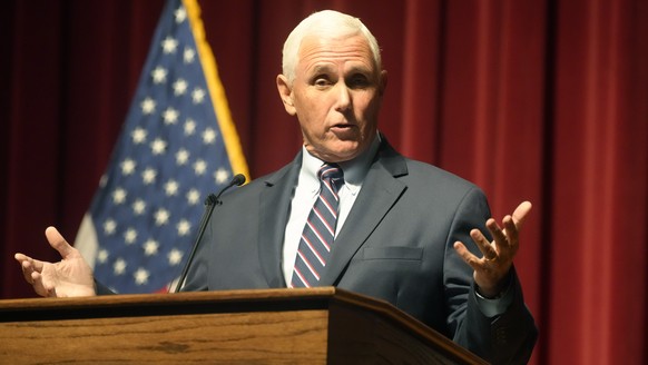 FILE - Former Vice President Mike Pence gives a lecture on national security at Wofford College, October.  18, 2022, in Spartanburg, SC Pence blames Donald Trump for endangering his family