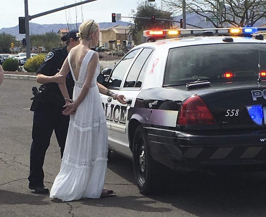 This photo provided by the Marana Police Department, in Arizona, shows 32-year-old Amber Young during her arrest on suspicion of impaired driving, Monday, March 12, 2018, in southern Arizona. Police s ...