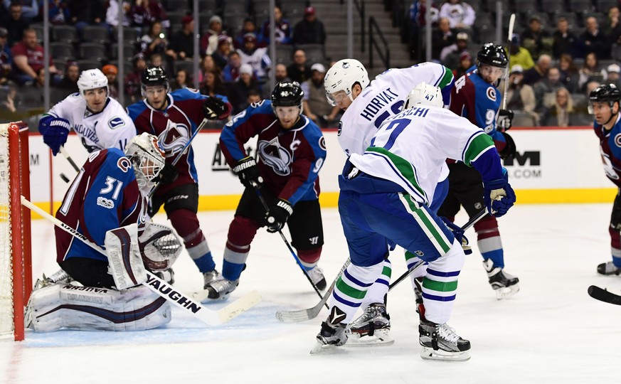 Jan 25, 2017; Denver, CO, USA; Vancouver Canucks left wing Sven Baertschi (47) backhands a goal past Colorado Avalanche goalie Calvin Pickard (31) in the first period at the Pepsi Center. Mandatory Cr ...