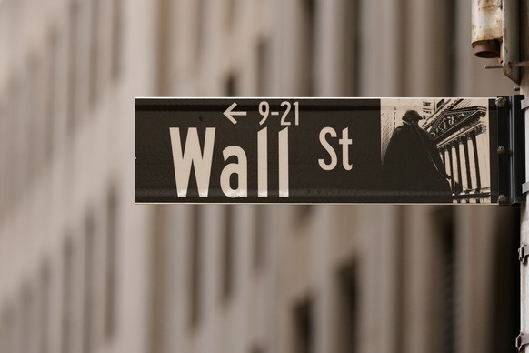 FILE - A Wall Street sign is seen outside of the New York Stock Exchange in New York, Monday, March 30, 2026. (AP Photo/Seth Wenig, File)
Financial Markets Wall Street