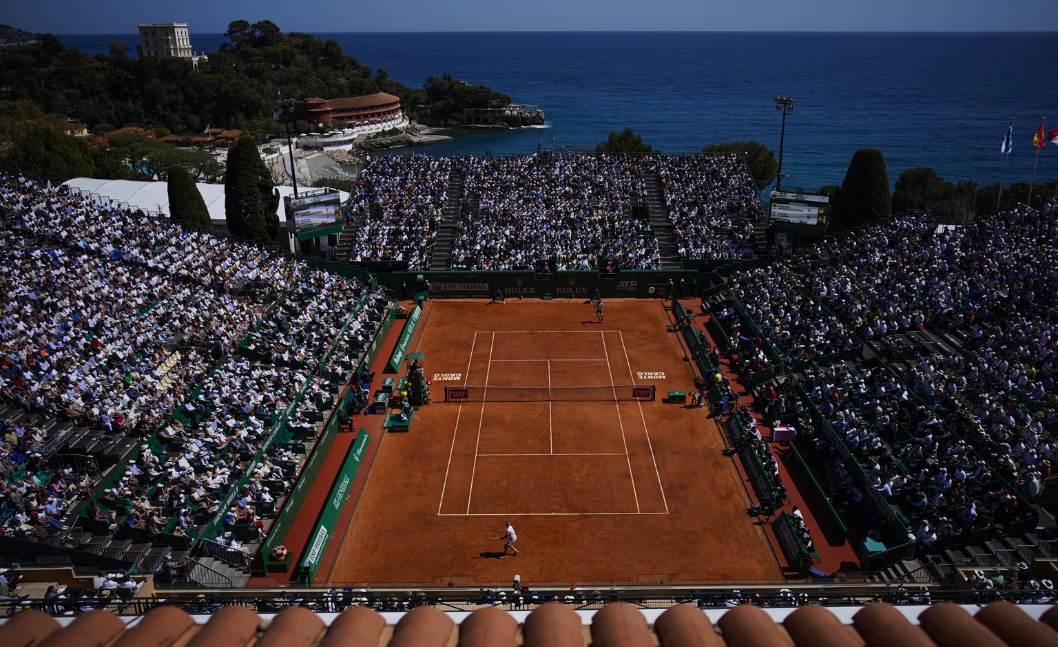 Spain&#039;s Alejandro Davidovich Fokina, bottom, returns a ball to Greece&#039;s Stefanos Tsitsipas during the final match of the Monte-Carlo Masters tennis tournament, Sunday, April 17, 2022 in Mona ...