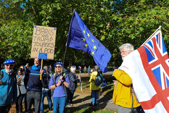 epa07932918 People prepare to attend the 'Together for the Final Say' march against Brexit in London, Britain, 19 October 2019. Hundreds of thousands of people are taking part in the protest march calling for a referendum on the final Brexit deal on 'Super Saturday', as members of parliament sit in the House of Commons in London to debate and vote on Prime Minister Boris Johnson's final Brexit deal.  EPA/VICKIE FLORES