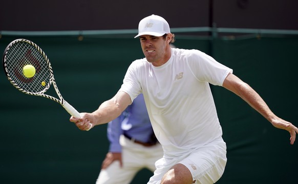 epa07691594 Reilly Opelka of USA returns to Stan Wawrinka of Switzerland in their second round match during the Wimbledon Championships at the All England Lawn Tennis Club, in London, Britain, 03 July ...