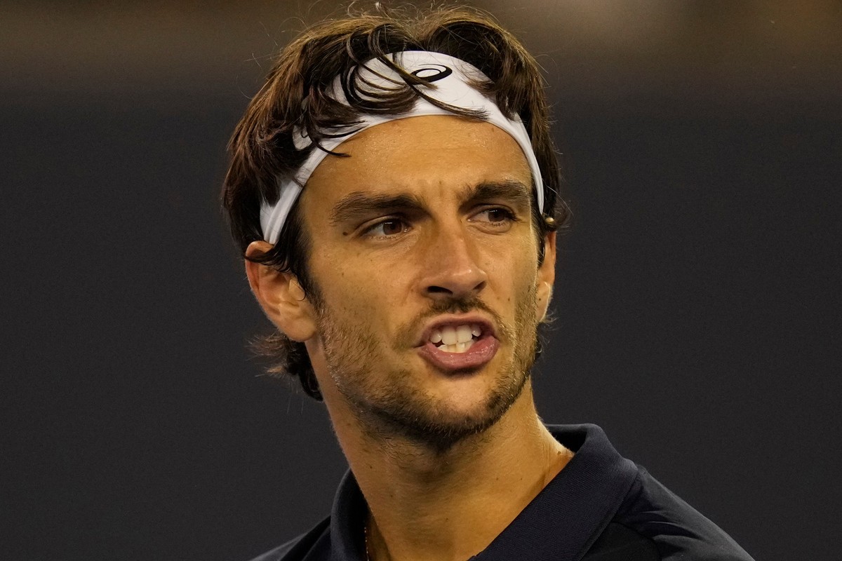 Lorenzo Musetti of Italy reacts during play against Giovanni Mpetshi Perricard of France in a men's singles match for the China Open tennis tournament in Beijing, China, Friday, Sept. 26, 2025. ( ...