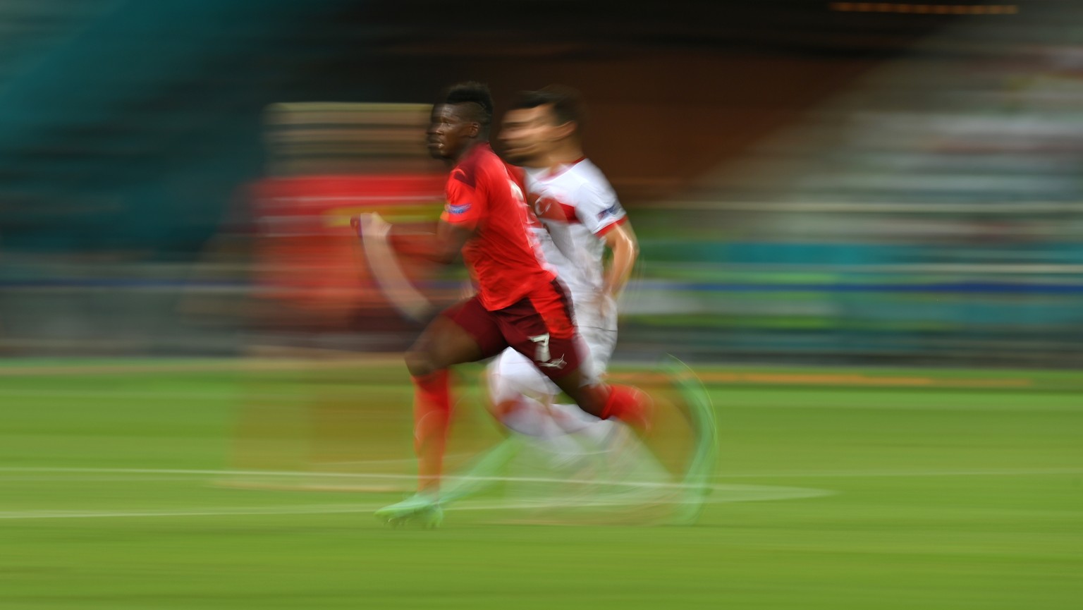 epa09288991 Breel Embolo (L) of Switzerland in actionduring the UEFA EURO 2020 group A preliminary round soccer match between Switzerland and Turkey in Baku, Azerbaijan, 20 June 2021. EPA/Dan Mullan / ...