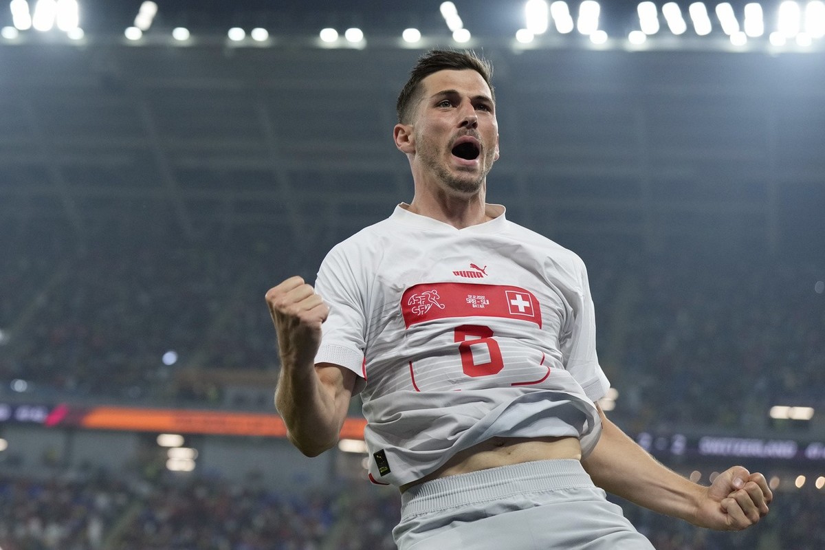 Switzerland's Remo Freuler celebrates after scoring his side's third goal during the World Cup group G soccer match between Serbia and Switzerland, in Doha, Qatar, Friday Dec. 2, 2022. (AP P ...