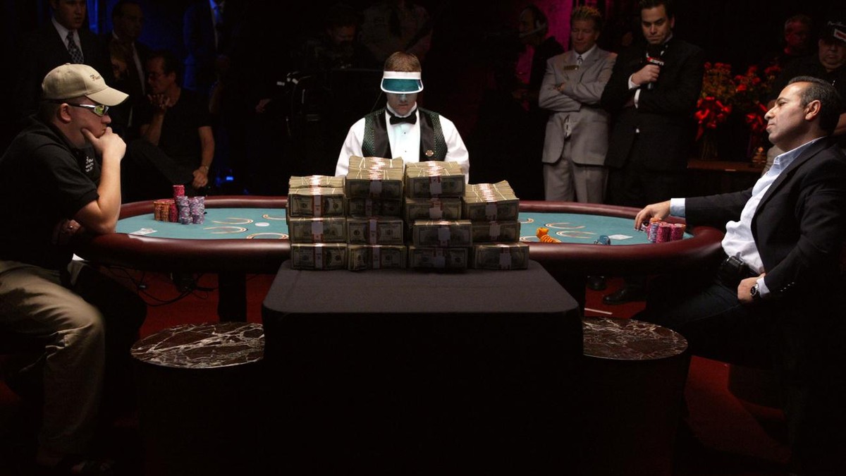 Ihsan "Sam" Farha, right, of Houston, tries to determine if Chris Moneymaker, of Spring Hill, Tenn., is bluffing after Moneymaker put all of his chips in the pot during the World Series of P ...