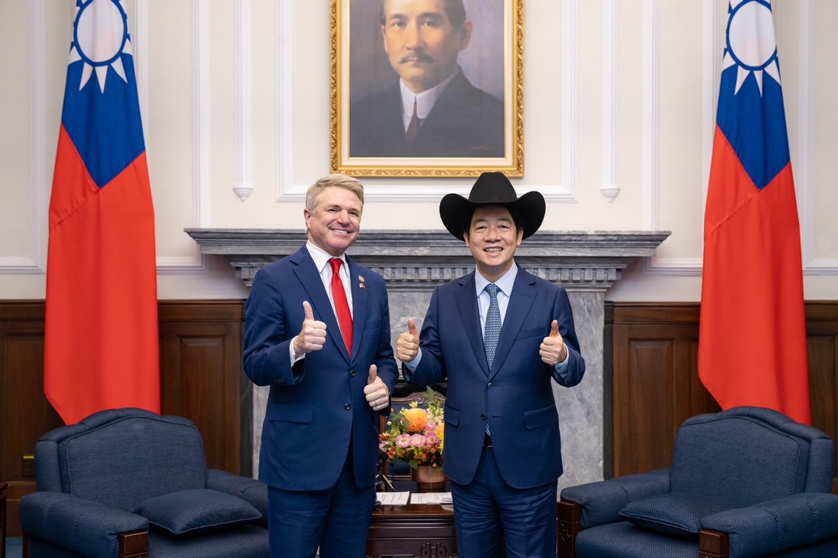 epa11372854 A handout photo made available by the Taiwan Presidential office shows Taiwan President William Lai (R) posing for a photograph with United States Representative Michael McCaul (L) during  ...