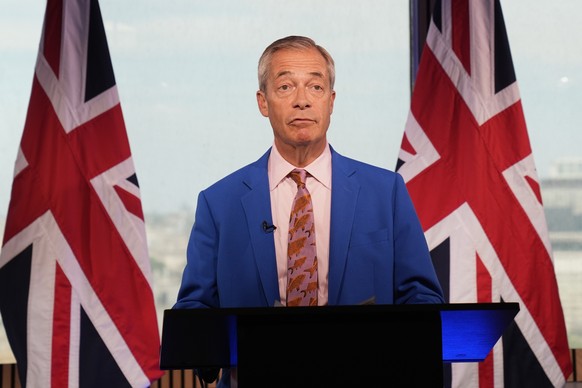 Reform UK leader Nigel Farage makes a statement to the media at the party headquarters in Millbank, central London, Tuesday July 7, 2026. (Gareth Fuller/PA via AP)
Britain Politics