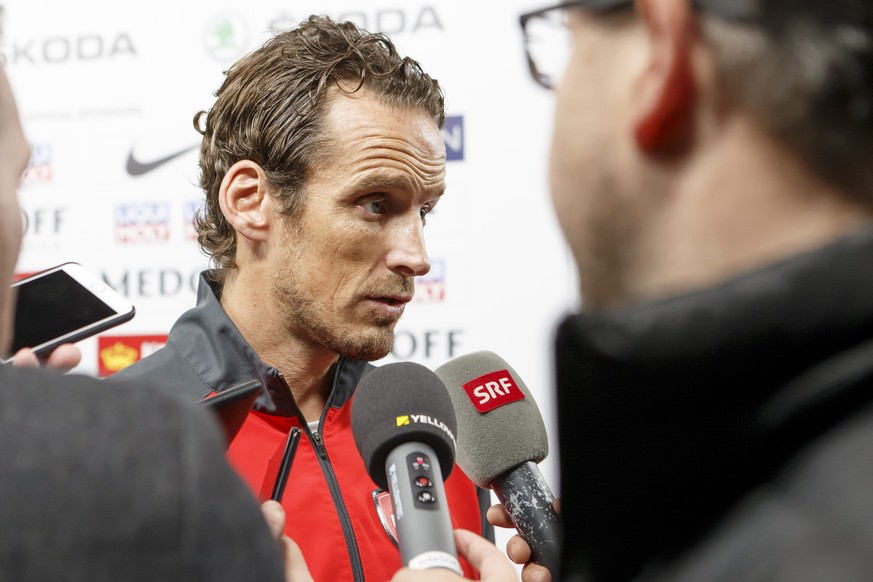 Patrick Fischer, head coach of Switzerland national ice hockey team, leaves the media briefing, during a Swiss team training optional session of the IIHF 2018 World Championship, at the Royal Arena, i ...