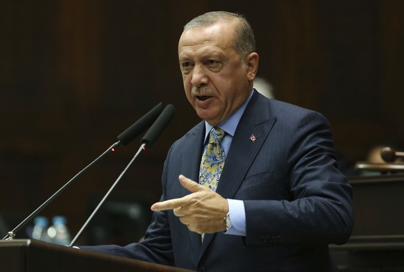Turkey's President Recep Tayyip Erdogan addresses members of his ruling Justice and Development Party (AKP), at the parliament in Ankara, Turkey, Tuesday, Oct. 23, 2018. Saudi officials murdered Saudi ...