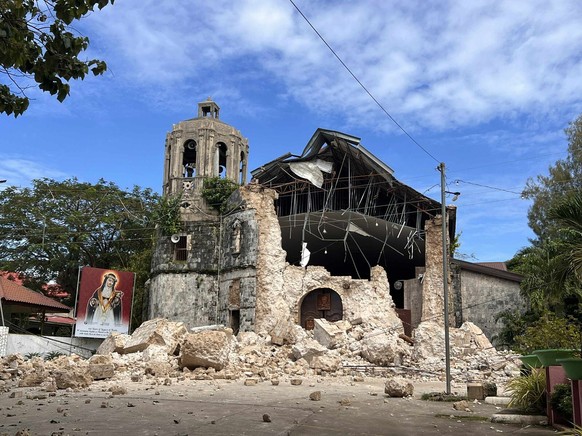 This photo shows the damages outside the Archdiocesan Shrine of Santa Rosa de Lima in Daanbantayan, Cebu, Philippines Wednesday, Oct. 1, 2025, after an offshore earthquakeon late Tuesday. (AP Photo)
P ...