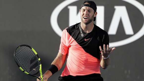 United States&#039; Jack Sock reacts to a lost point against Japan&#039;s Yuichi Sugita during their first round match at the Australian Open tennis championships in Melbourne, Australia, Monday, Jan. ...