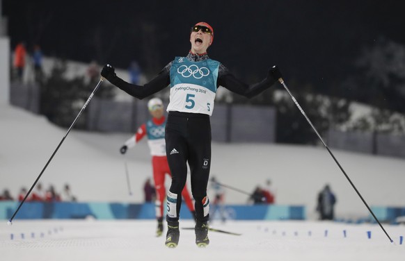 Eric Frenzel, of Germany, celebrates after winning the the gold medal after the 10km cross-country skiing portion of the nordic combined event at the 2018 Winter Olympics in Pyeongchang, South Korea, Wednesday, Feb. 14, 2018. (AP Photo/Kirsty Wigglesworth)