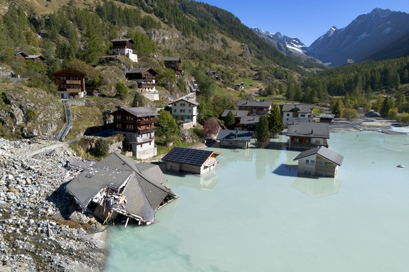 epa12389506 A picture taken with a drone shows a view of the devastated village of Blatten during the groundbreaking ceremony for its reconstruction project, known as &#039;Blatten 2030,&#039; just 3, ...