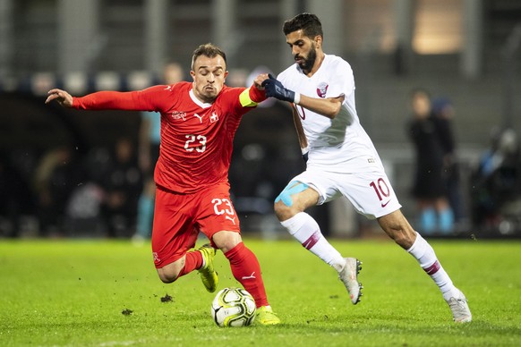 epa07165440 Switzerland&#039;s Xherdan Shaqiri (L) in action against Qatar&#039;s Hassan Khalid Al Haidos (R) during the International Friendly soccer match between Switzerland and Qatar in Lugano, Sw ...