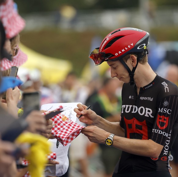 epa13112511 Swiss cyclist Yannis Voisard of Tudor Pro Cycling Team signs autographs at the signature sign-on ahead of Stage 11 of the Tour de France, a 161.3 km route from Vichy to Nevers, France, 15  ...