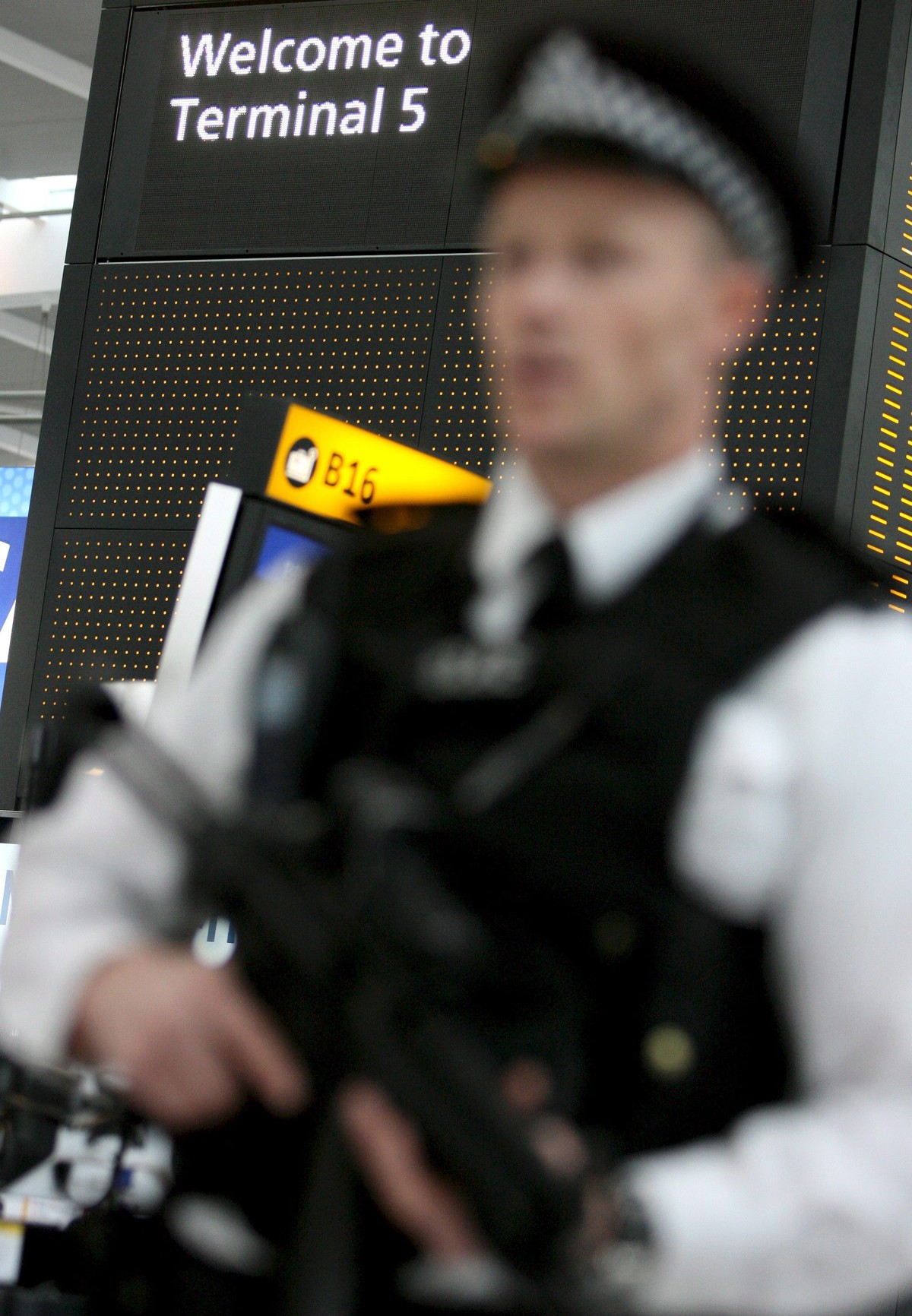 epa04296343 (FILE) A file picture dated 14 March 2008 shows an armed police officer on patrol at Heathrow airport's new Terminal 5 in London, Britain. US security officials are seeking to bolster ...
