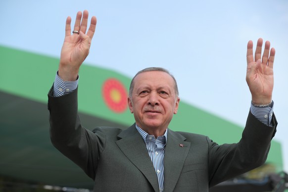 epa09984636 A handout photo made available by the Turkish President&#039;s Press Office shows Turkish President Recep Tayyip Erdogan greets his supporters during a ceremony of the transformation of th ...