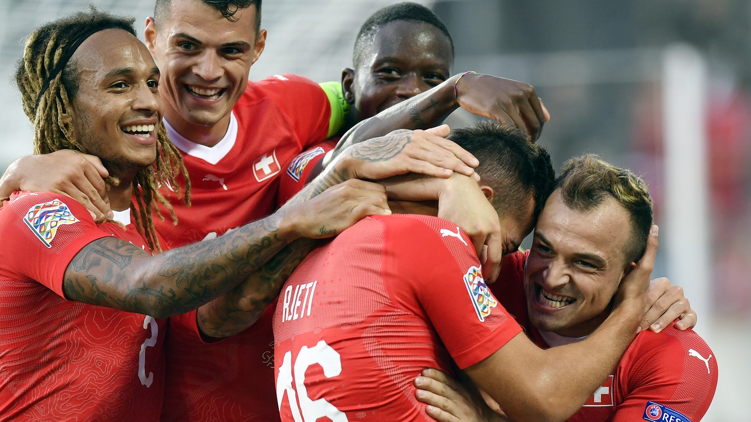 Switzerland&#039;s Kevin Mbabu, Granit Xhaka, Denis Zakaria, Albian AJeti and Xherdan Shaqiri, celebrates after the gift goal during the UEFA Nations League group stage match between Switzerland and I ...