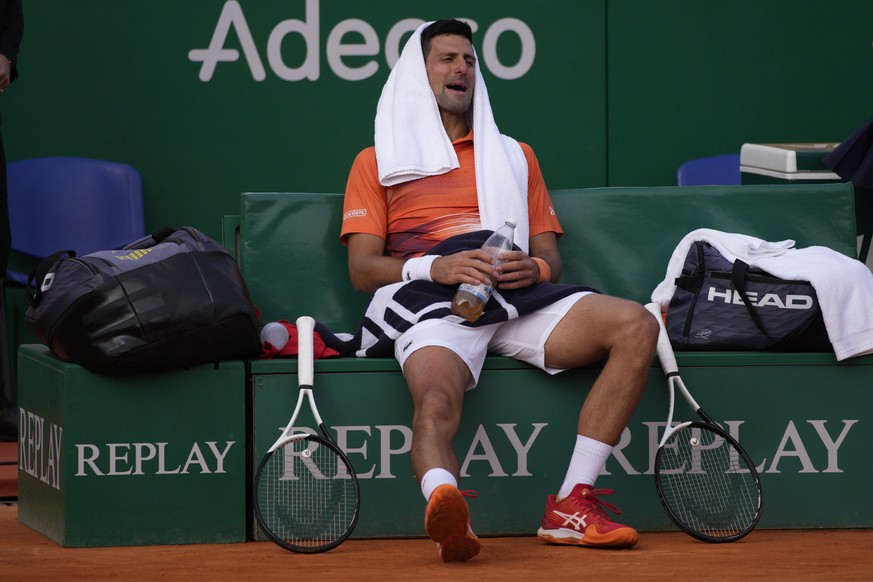 Serbia&#039;s Novak Djokovic rests during a break as he plays Spain&#039;s Alejandro Davidovich Fokina during their second round match at the Monte-Carlo Masters tennis tournament, Tuesday, April 12,  ...