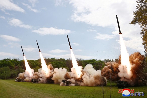 epa11294998 A photo released by the official North Korean Central News Agency (KCNA) shows missiles launched during a simulated nuclear counterattack drill at an undisclosed location, North Korea, 22  ...