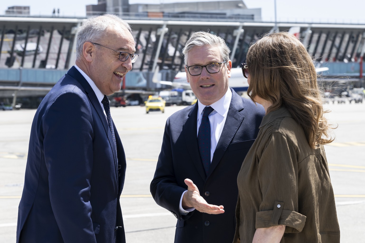 Swiss Federal President Guy Parmelin, left, welcomes Britain's Prime Minister Keir Starmer, center and his wife Victoria Starmer, right, at Geneva Airport prior the G7 summit in nearby Evian (Fra ...