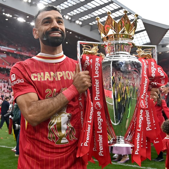 epa12134913 Liverpool player Mohamed Salah celebrates with the Premier League trophy after the English Premier League match between Liverpool and Crystal Palace in Liverpool, Britain, 25 May 2025. EPA ...