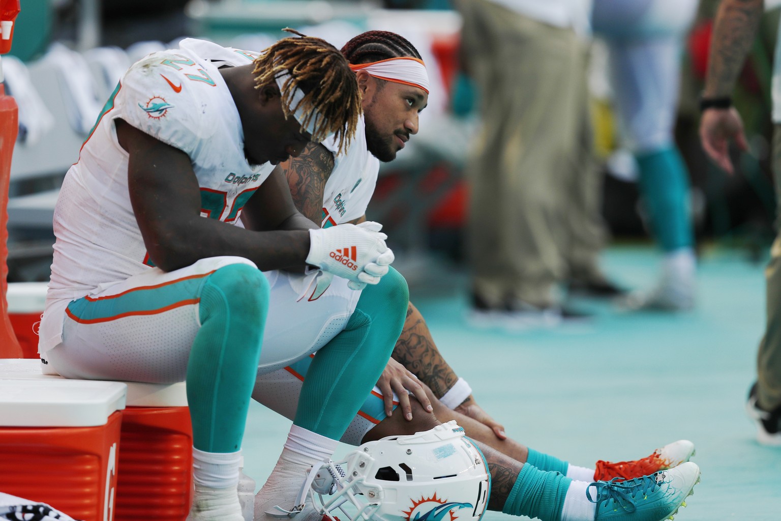 FILE - In this Sept. 8, 2019, file photo, Miami Dolphins running back Kalen Ballage (27) sits on the sideline during the second half at an NFL football game against the Baltimore Ravens, in Miami Gard ...