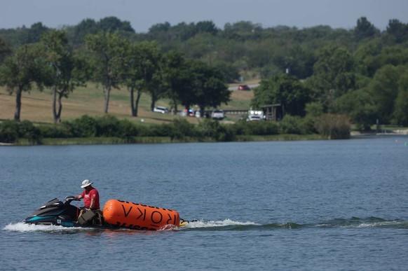 August 8, 2024: A jet ski pulls in buoys from the CrossFit Games at Marine Creek Lake in Fort Worth on Thursday morning, Aug. 8, 2024. The Fort Worth Fire Department responded to a call earlier in the ...