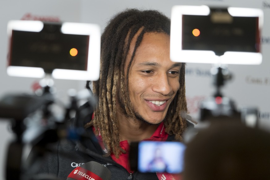 Switzerland&#039;s national soccer team player Kevin Mbabu speaks during a press conference before the upcoming UEFA Euro 2020 qualifying soccer matchs, at the Stade Olympique de la Pontaise in Lausan ...